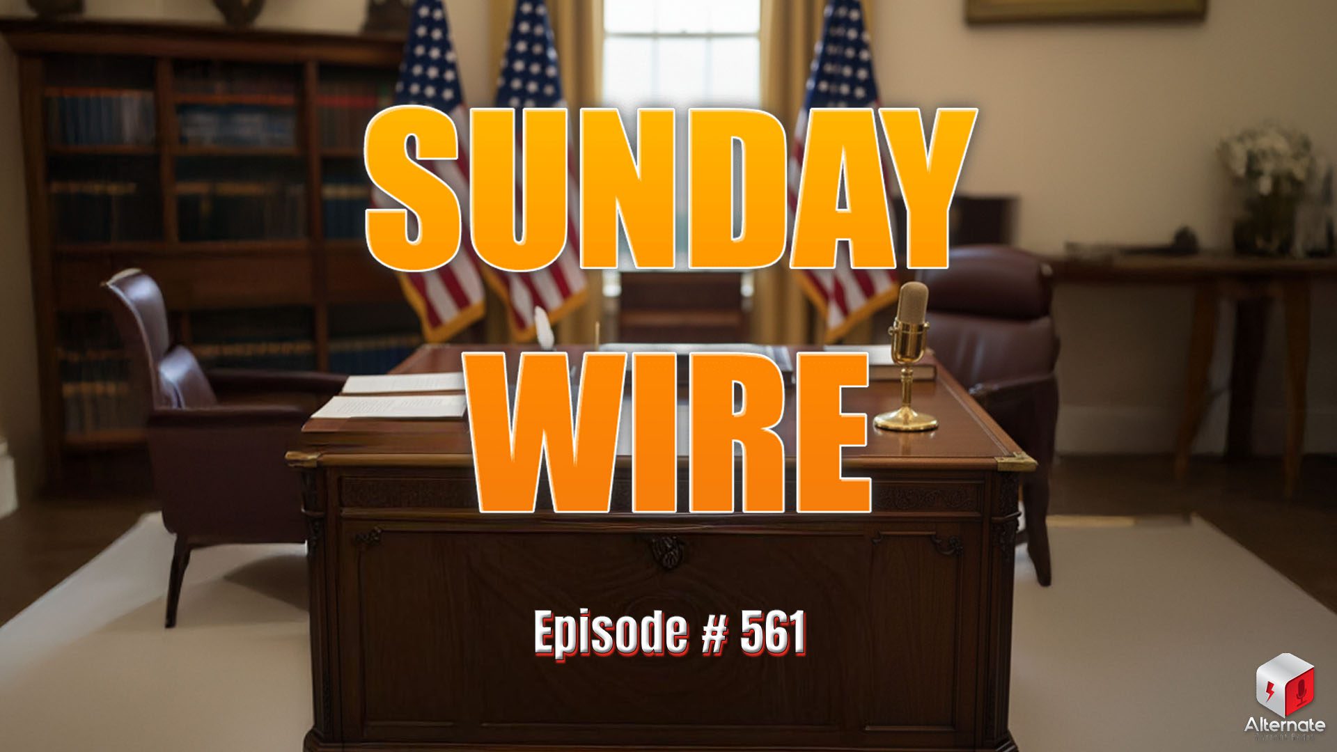 A large wooden desk sits in a formal office with three American flags behind it. On the desk are papers, a lamp, and a gold podcast microphone. A leather chair faces the desk, and the room includes bookshelves, framed artwork, and a side table with flowers and a computer monitor.